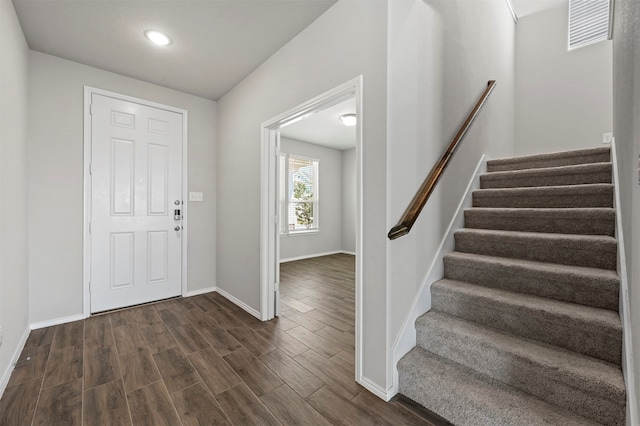 foyer entrance with dark hardwood / wood-style flooring