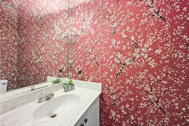 bathroom with vanity and toilet