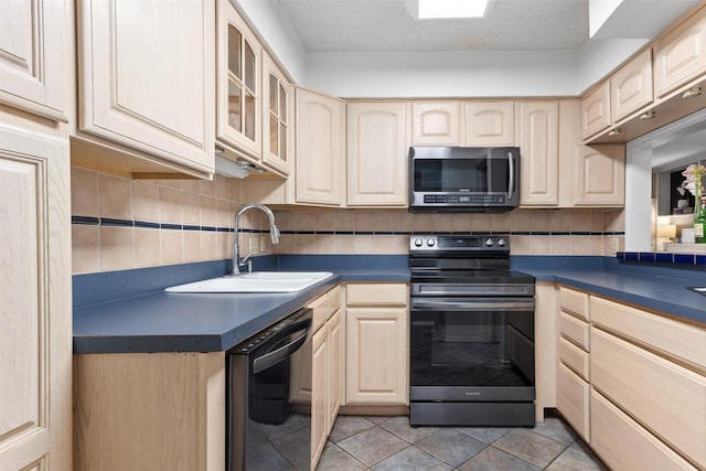 kitchen featuring electric range oven, black dishwasher, sink, backsplash, and light brown cabinets