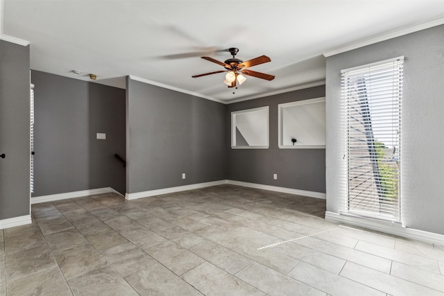 empty room featuring ceiling fan, crown molding, plenty of natural light, and tile patterned flooring