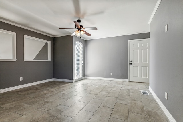 tiled spare room featuring ceiling fan and crown molding