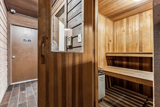 view of sauna / steam room featuring wood walls