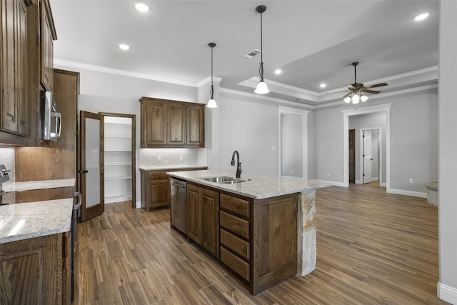 kitchen featuring backsplash, sink, dark hardwood / wood-style floors, and appliances with stainless steel finishes