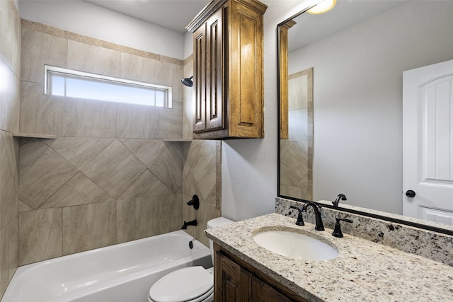 full bathroom featuring toilet, tiled shower / bath combo, and vanity