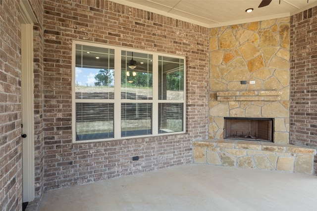 view of patio with an outdoor stone fireplace