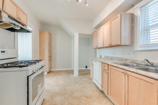 kitchen featuring light tile patterned floors, light brown cabinets, sink, and white appliances