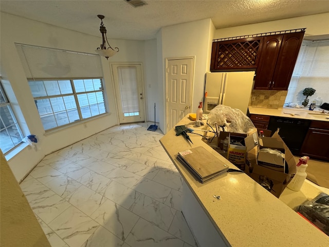 kitchen with white refrigerator with ice dispenser, dishwasher, hanging light fixtures, marble finish floor, and light countertops