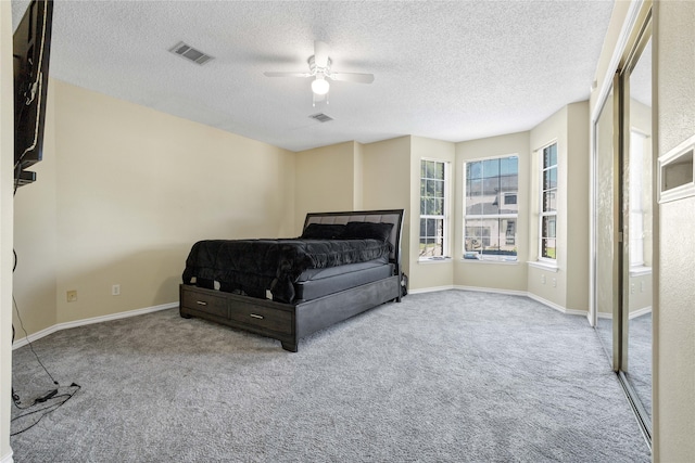 bedroom with light carpet, visible vents, and baseboards