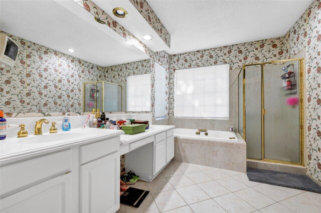 full bathroom featuring a textured ceiling, a stall shower, vanity, and wallpapered walls