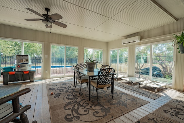 sunroom / solarium with ceiling fan and a wall mounted air conditioner