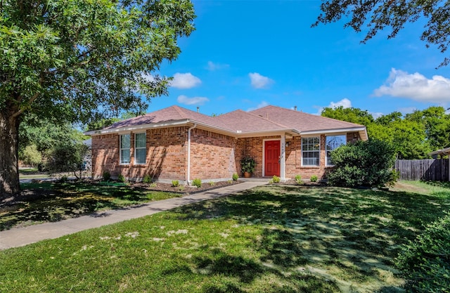 single story home with a front yard