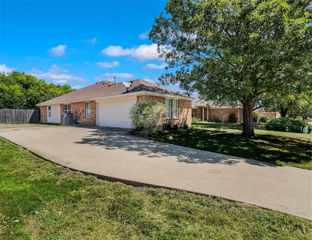 view of property exterior with central AC, a yard, and a garage