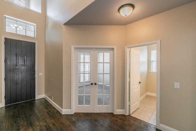 foyer featuring hardwood / wood-style floors and french doors