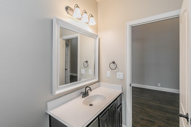 bathroom with vanity and hardwood / wood-style floors