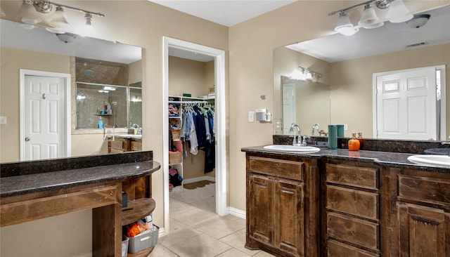 bathroom featuring double vanity and tile patterned floors