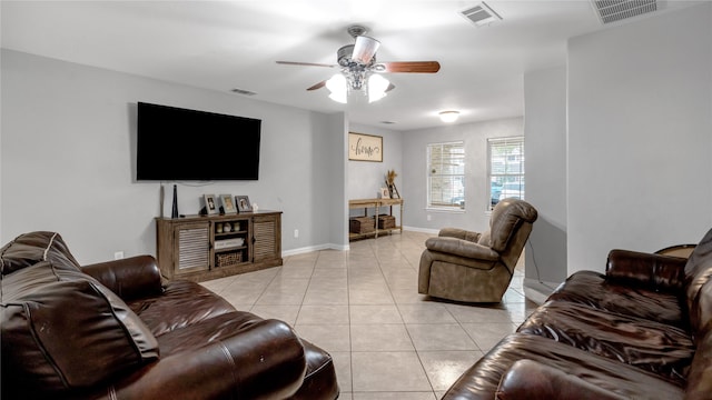 tiled living room with ceiling fan