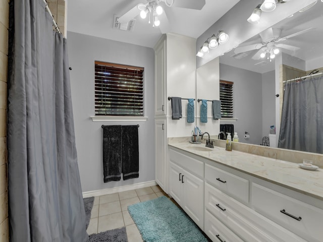 bathroom with ceiling fan, tile patterned floors, and vanity