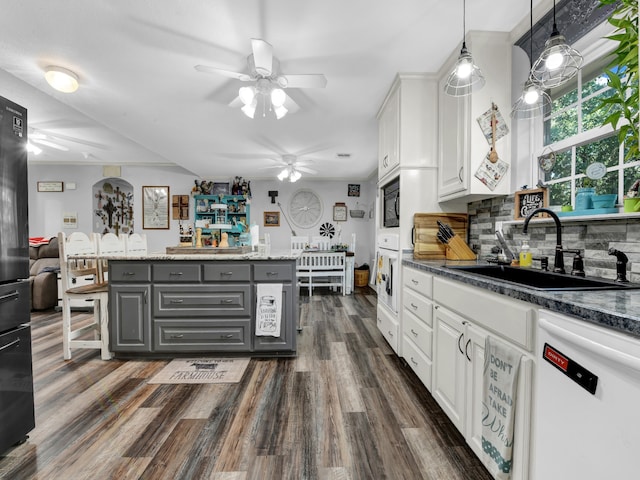 kitchen featuring ceiling fan, dark wood-type flooring, gray cabinets, white cabinetry, and black appliances