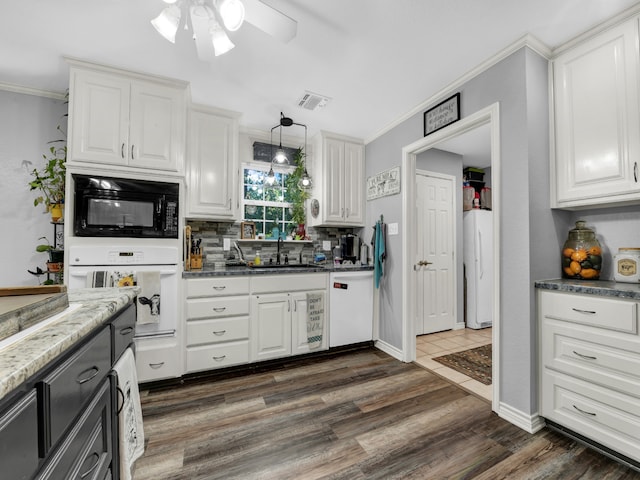 kitchen with dark hardwood / wood-style flooring, white cabinetry, white appliances, and ceiling fan