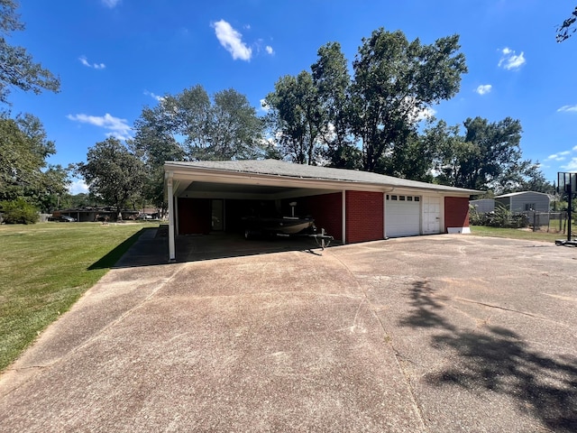 exterior space with a lawn and a carport