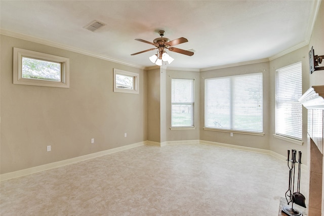 unfurnished room featuring ceiling fan, plenty of natural light, and ornamental molding