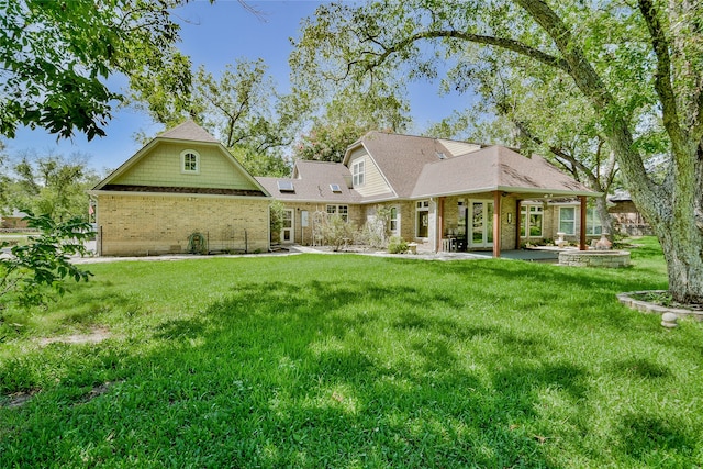 view of front of property featuring a patio area and a front lawn