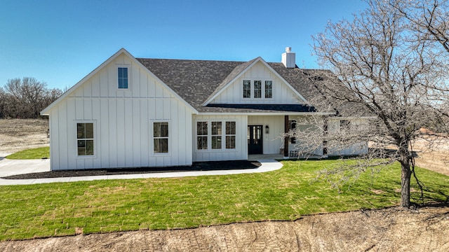 rear view of house with a lawn