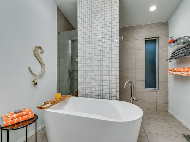 bathroom with plus walk in shower and tile patterned floors