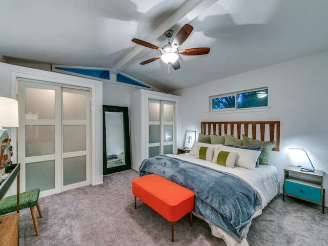 bedroom featuring lofted ceiling with beams, ceiling fan, and carpet