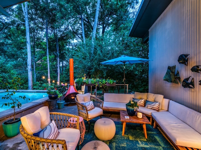 view of patio featuring outdoor lounge area and a pool