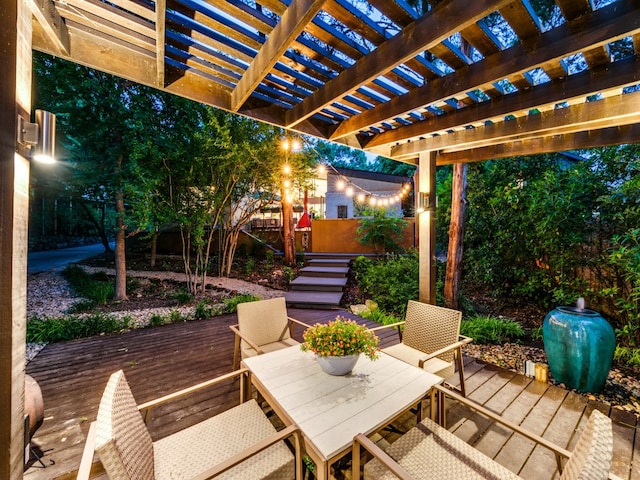 view of patio / terrace featuring a wooden deck and a pergola