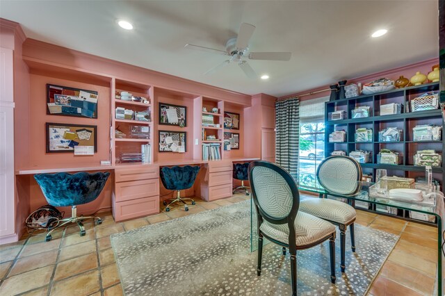 office featuring ceiling fan and built in desk