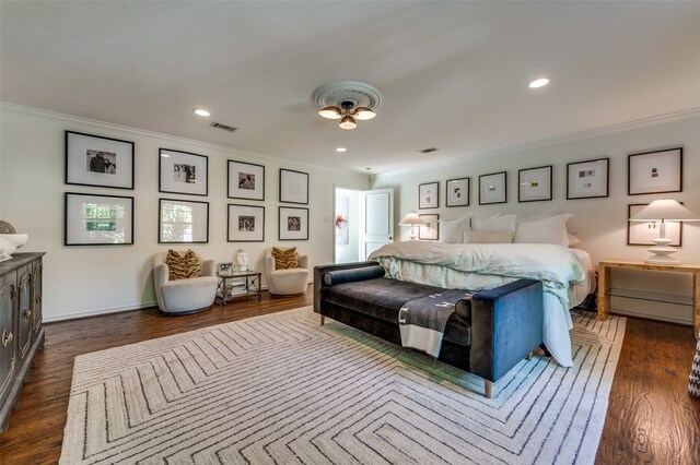 bedroom featuring dark hardwood / wood-style floors and crown molding