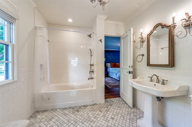 bathroom with ornamental molding, hardwood / wood-style floors, shower / bath combo with shower curtain, and tile walls