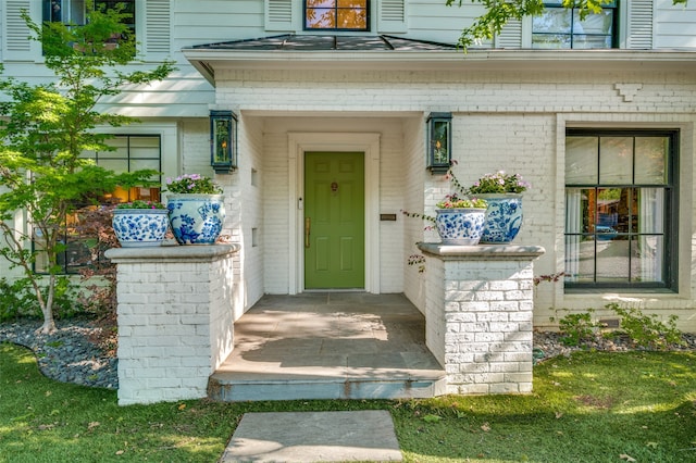 doorway to property featuring a yard