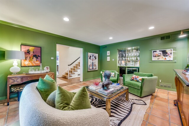 living room with beverage cooler, bar, light tile patterned floors, and crown molding