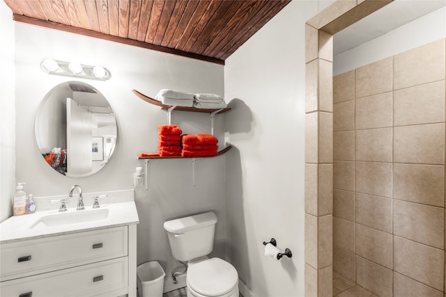 bathroom featuring wood ceiling, toilet, and vanity