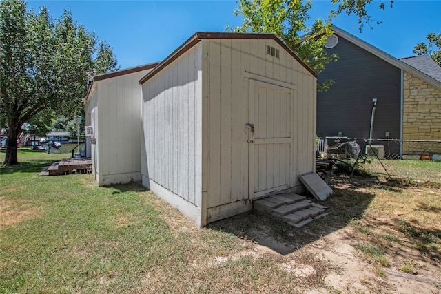 view of outdoor structure with a lawn