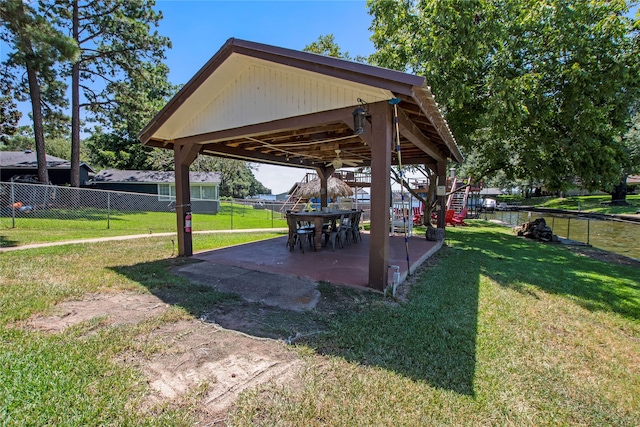 view of community with a patio and a yard