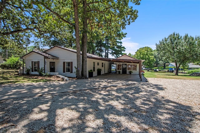 ranch-style house with a carport