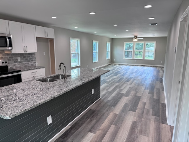 kitchen featuring white cabinetry, stainless steel appliances, sink, ceiling fan, and dark hardwood / wood-style floors