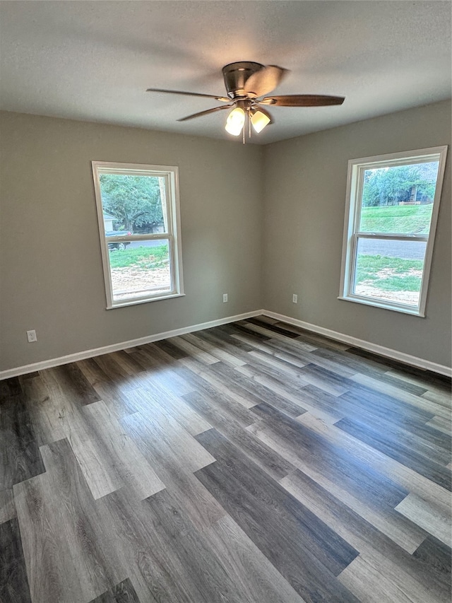 spare room with ceiling fan, hardwood / wood-style flooring, and a textured ceiling