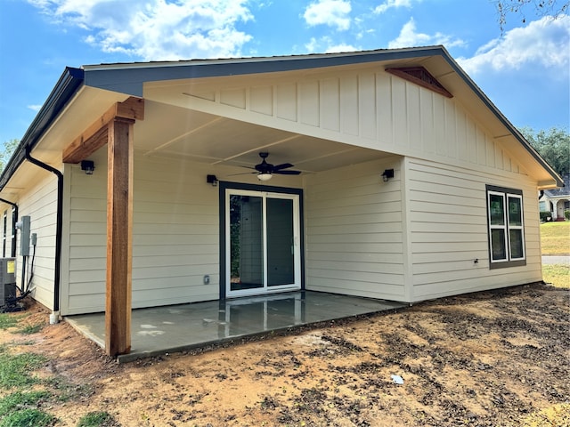 rear view of house featuring ceiling fan and a patio area