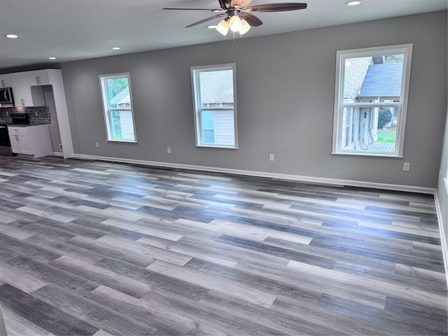 interior space featuring hardwood / wood-style floors and ceiling fan