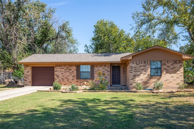 single story home featuring a front yard and a garage