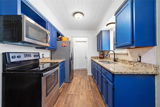 dining space with sink, light wood-type flooring, wood ceiling, rail lighting, and ornamental molding