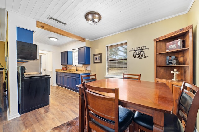 laundry room featuring independent washer and dryer, wooden ceiling, and light hardwood / wood-style flooring