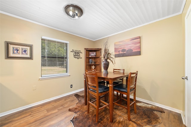 carpeted bedroom featuring ceiling fan, crown molding, and wooden ceiling