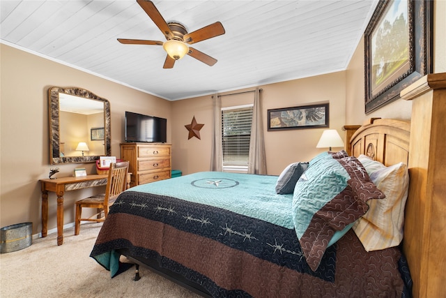 bedroom featuring ceiling fan, ornamental molding, wood ceiling, and light colored carpet