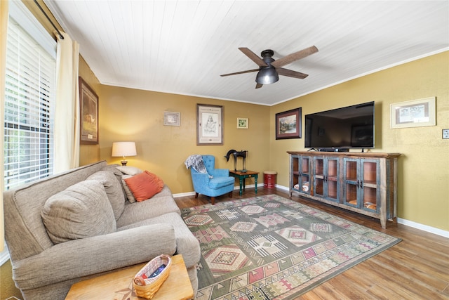 living room with ornamental molding, wood ceiling, light hardwood / wood-style floors, and ceiling fan